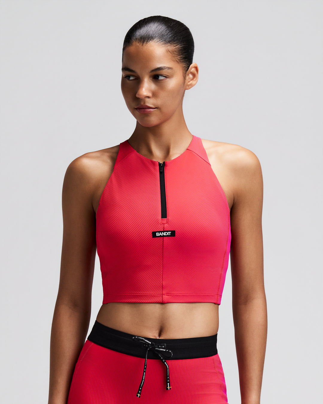 Bandit Women's Striped Cadence Zip Front Race Crop - Poppy/Azalea - AW26